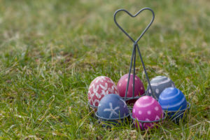 Nest of natural-colored Easter eggs in the garden Nest of natural-colored Easter eggs in the garden
